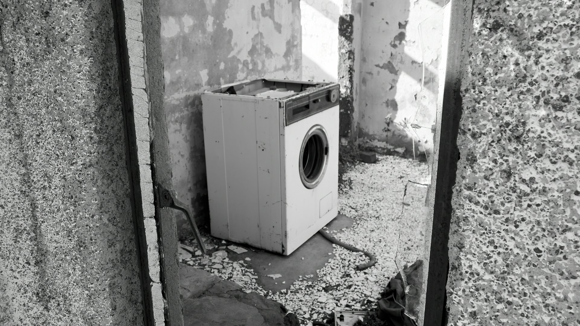 Old abandoned washing machine in an abandoned house